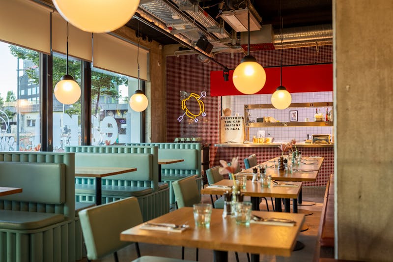 Cozy corner booth seating with warm ambient lighting