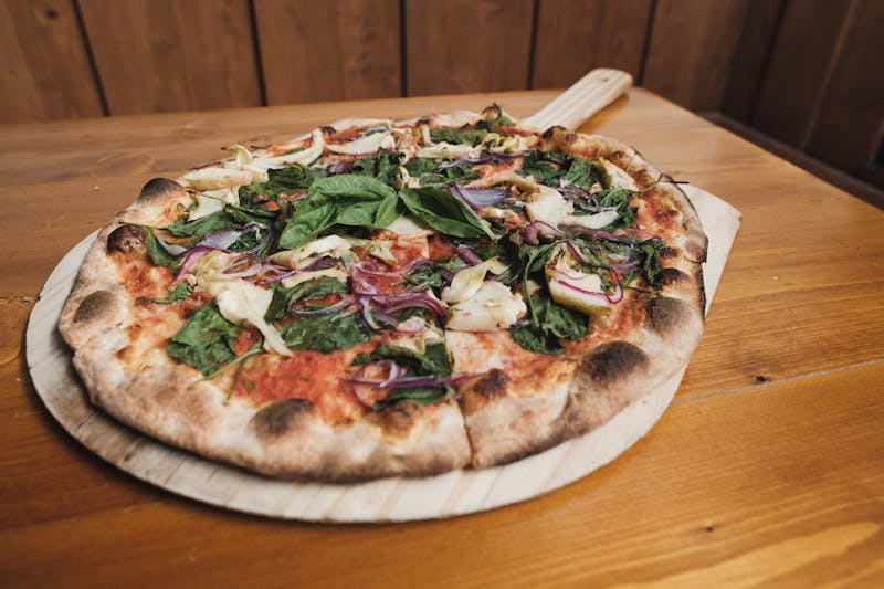 Veggie supreme pizza with colorful toppings